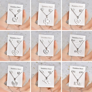 Detailed macro view of nine stainless steel heart and clover jewelry sets on cards
