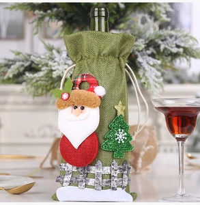Detail of Christmas burlap wine bottle cover with Santa applique and drawstring closure
