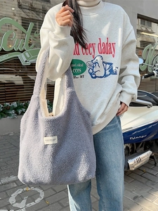 Grey reversible plush tote bag with shoulder strap and large capacity for daily commute