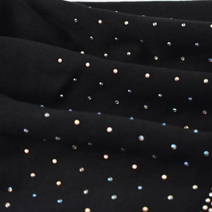 Black knitted winter beanie for women with colorful sparkling rhinestones and warm fabric