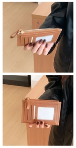 Close-up of brown litchi pattern PU leather card holder with three slots and zipper pocket
