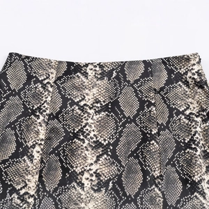 Women's chic snake print satin midi skirt featuring neutral beige and black tones