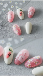 Detailed macro view of 5D nail art stickers featuring pink bunnies and daisy patterns