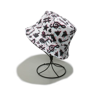 Close-up of trendy bucket hat featuring glitch art music notes and neon symbol prints