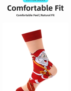 Close-up of pink Christmas cotton socks featuring Santa Claus and red cuffs detail