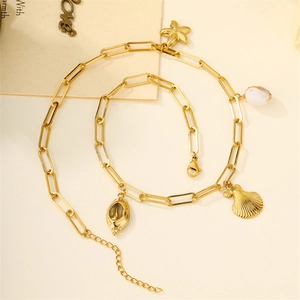 Gold stainless steel ocean necklace with starfish, seashell pendants and white beads
