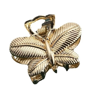 Elegant gold butterfly hair claw clip with vintage metallic texture for side fringe styling