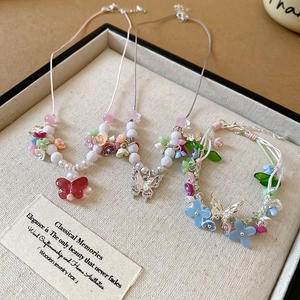 Handmade butterfly and flower jewelry set with colorful resin beads and pearl accents