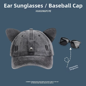 Detailed view of grey washed cotton cat ear baseball cap with removable square sunglasses