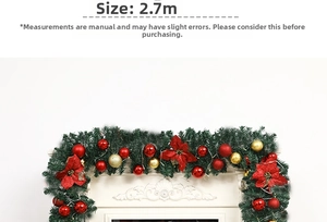 2.7m Christmas garland with red gold baubles and poinsettia flowers on a white fireplace