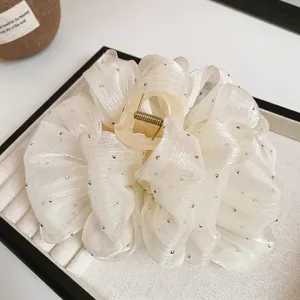 Elegant white bow hair claw clip with rhinestones and soft tulle fabric for women
