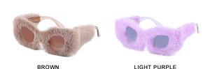 Close-up of plush velvet textured frames in brown and light purple fashion cat-eye sunglasses