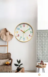 Detail of 12-inch wall clock with colorful Arabic numerals and three-color hands