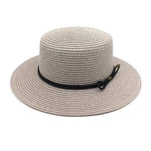 Detailed close-up of a woven wide-brim boater hat with black rope bow accent