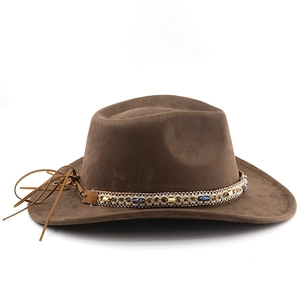 Close-up of bohemian beaded band and soft suede texture on a dark brown felt jazz hat