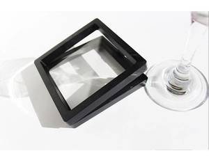 Macro shot of black square suspension jewelry display box with clear PE film membrane