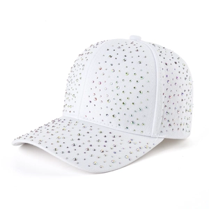 Close-up of sparkling AB rhinestones on a white cotton baseball cap with fabric texture