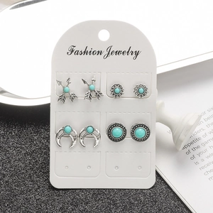Bohemian vintage stud earring set with arrow, sun, moon and turquoise stones on white card