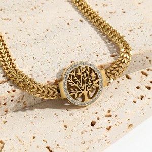 Bracelet arbre de vie doré avec pavé de zircons et une chaîne de blé tressée élégante
