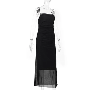 Detail view of black bodycon dress featuring slim shoulder straps and mesh hemline