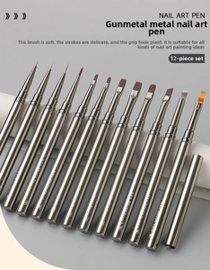 Detailed view of 12-piece gunmetal nail art brush set with assorted professional tips