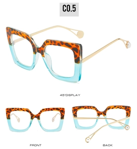 Detail of square glasses with leopard upper frame, blue lower frame and pearl temples