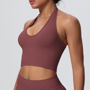 Detailed side view of breathable halter neck yoga bra in dark mauve seamless ribbed fabric