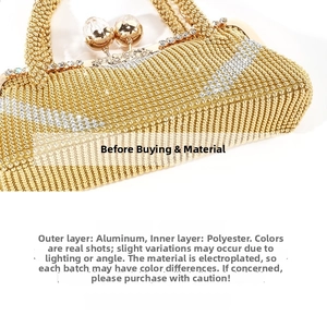 Detail of evening clutch bag showing gold and silver aluminum bead textures and chain