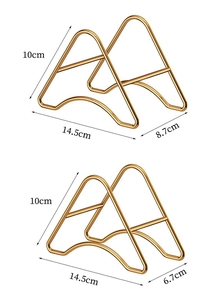 Detailed view of two gold metal display stands showing precise dimensions for storage