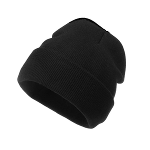 Close-up of black knitted beanie showing detailed ribbed texture and classic rolled cuff