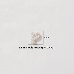 Macro detail of gold S925 silver letter P pendant with zircon pavé and 9mm size specs