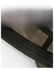 Detail of camouflaged flat top hat featuring a wide, breathable moisture-wicking sweatband