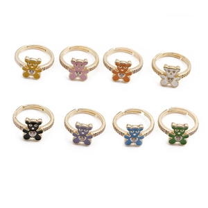 Detail of colorful enamel bear rings with heart zircons and gold-plated band