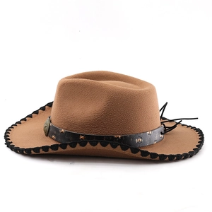 Detail view of camel felt cowboy hat with braided edges and studded leather band