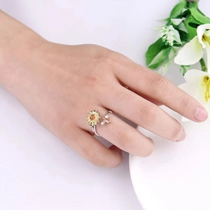 S925 silver sunflower rotating ring with golden bee and sparkling crystals on model finger