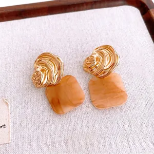 French luxury square pleated jewelry set with gold textured metal and amber resin drops