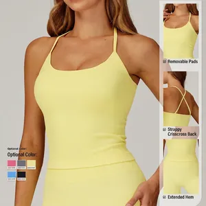 Seamless light yellow ribbed yoga top with cross-back thin straps and longline hem
