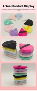 Dettaglio macro di piumini da trucco triangolari in colori macaron con nastri di supporto