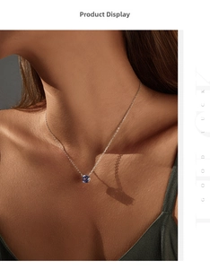 Gros plan d'un collier en argent S925 avec pendentif bleu tanzanite sur cou