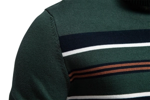 Close-up of dark green knit sweater featuring white and brown striped texture details