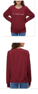Detail of burgundy mama sweater showing ribbed cuffs and soft cotton fabric texture