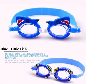 Detail view of cartoon shark and small fish themed blue swimming goggles for children