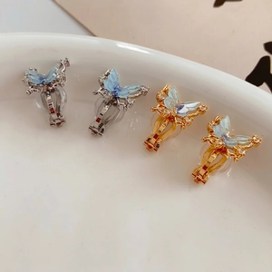 18k gold plated butterfly ear clips with blue translucent wings and zircon accents