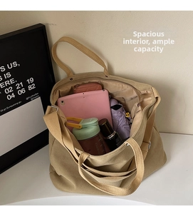 Internal view of the cream canvas tote bag showing large capacity for daily essentials