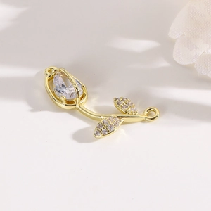 Detailed view of golden tulip connector charm with inlaid cubic zirconia for DIY jewelry