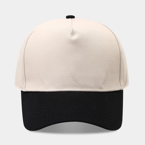 Front view of a 5-panel baseball cap with beige top and curved black brim detail