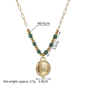 Bohemian gold stainless steel necklace featuring green beads and a central evil eye coin charm