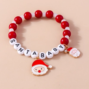Detail of Christmas beaded bracelet with Santa Baby letters and Santa Claus enamel charms
