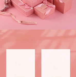 Pink gift boxes featuring elegant silk ribbon bows for cosmetics and perfume packaging