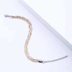 Three-tone braided snake chain bracelet in gold, silver, and rose gold finishes